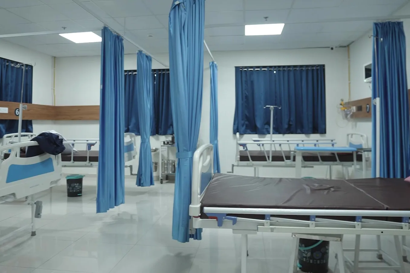 A ward bay at Junagadh, beds made and empty.