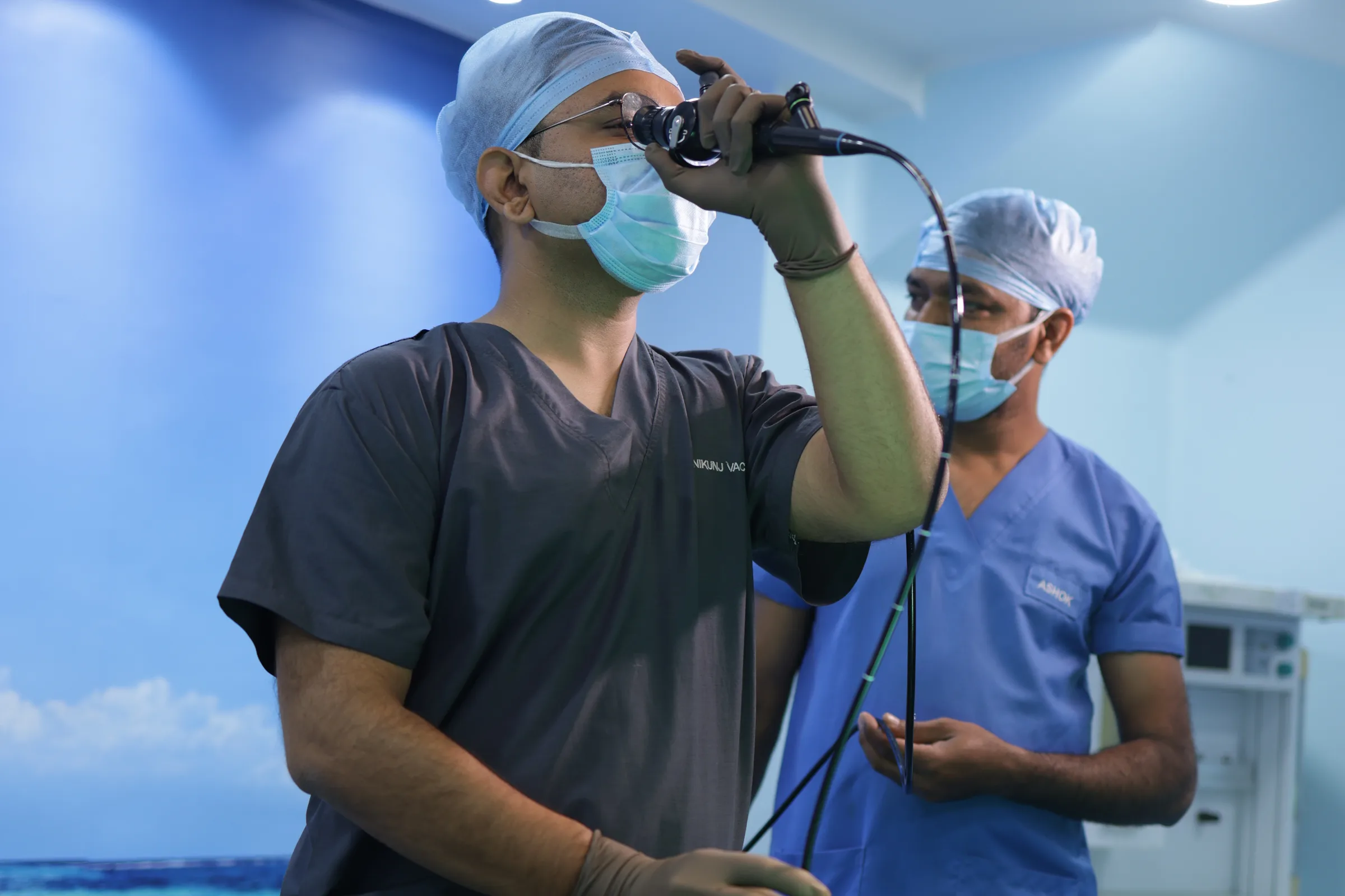 A surgeon checking an examination scope before a procedure.