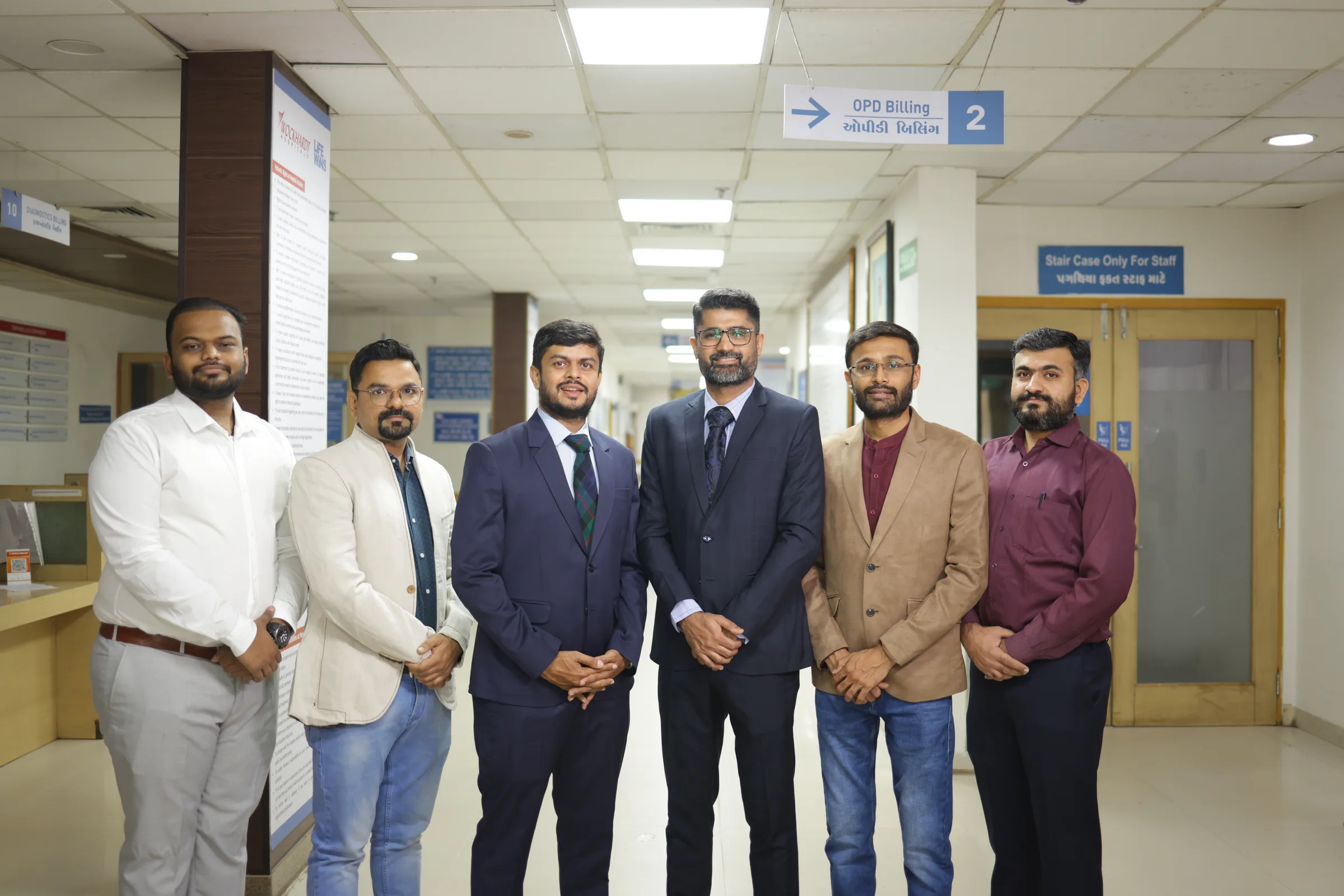 The practice's cancer surgeons standing together in the outpatient department.